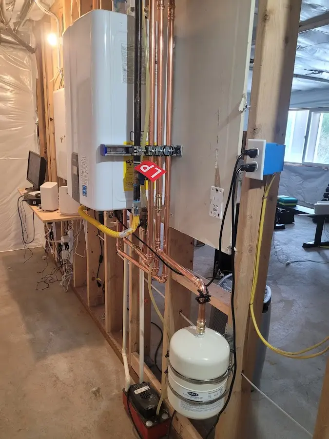 Licensed plumber repairing a kitchen sink in Fraser